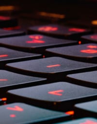 Close up of a backlit laptop keyboard